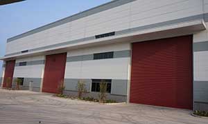 淮安高鋒機(jī)械卷簾門案例 - 中出網(wǎng)-智能出入口與停車充電門戶